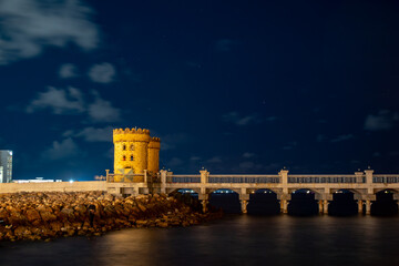 Alexandria, Egypt A night view of ancient stone towers at the Qaitbay Citadel on the Corniche.