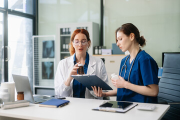 Doctors and nurses collaborating in a modern medical office, showcasing teamwork and patient care.