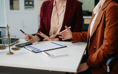 Business and lawyers discussing contract papers with brass scale on desk in office. Law, legal...