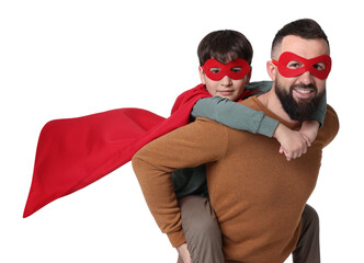 Father and his son wearing superhero costumes on white background © New Africa