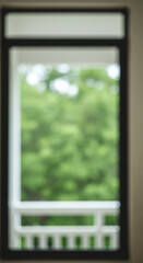 Fototapeta premium Through the Window: Green Haze of Summer, Blurry View. Nature, Serenity, Black Frame, Bright, Abstract