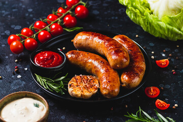 Fried sausages with vegetables and garlic
