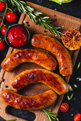 Fried sausages with vegetables and garlic