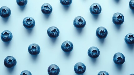 Bright, fresh blueberries placed individually on a white background, with their deep blue color contrasting beautifully.