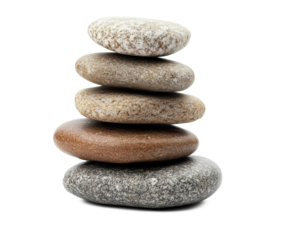 A balanced stack of smooth pebbles isolated on a white background