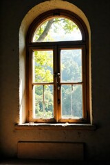 Sunlight through antique windowpane, cracked plaster, window, interior, elegant
