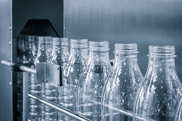 Bottle. Industrial production of plastic pet bottles. Factory line for manufacturing polyethylene...