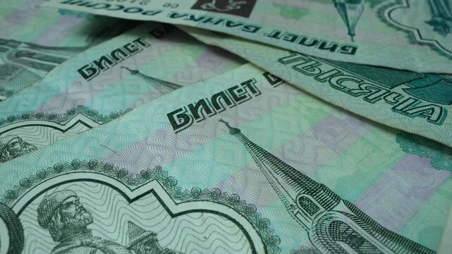 A close-up view of money being counted by a machine