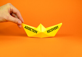 Addiction recovery symbol. Concept words Addiction recovery on beautiful yellow paper boat....