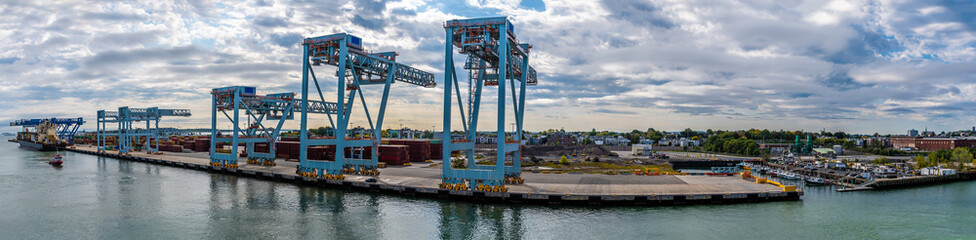 A ultra wide angle view across the container port in Boston in the early morning in the fall