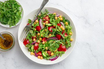 Raw vegan chickpeas and  vegetables salad