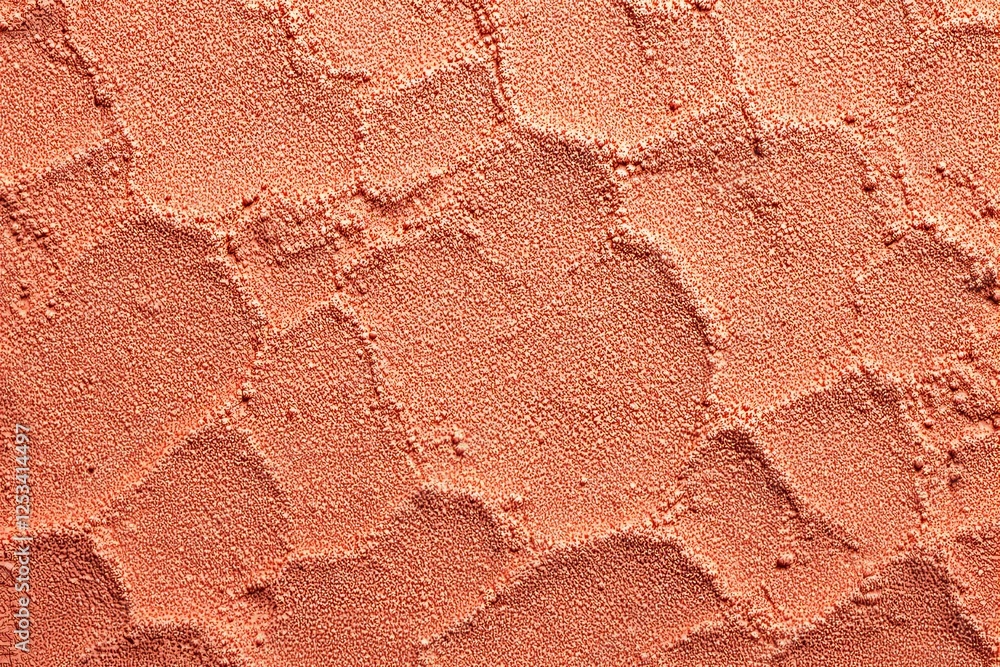 Poster Close-up of textured orange surface with geometric patterns and small granular details.