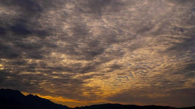 Timelapse of stunning textured sky in the mountains on the seashore