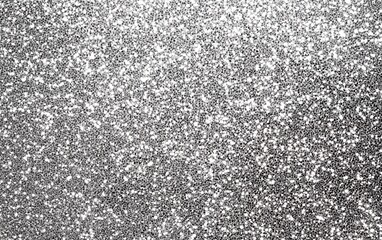 Shiny silver glitter texture with sparkling light reflection and metallic glow for luxury elegant abstract design and festive decorative background