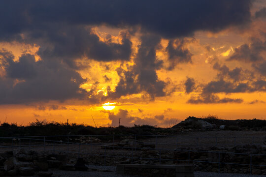 Dramatic sunset over the archaeological site in Paphos Greece Paphos 20.11.2024 - Powered by Adobe
