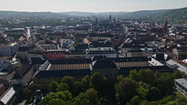 Aerial drone view of Stiftung Juliusspital W&uuml;rzburg, Germany. This architectural landmark features Baroque buildings, a grand courtyard, and lush vineyards. 