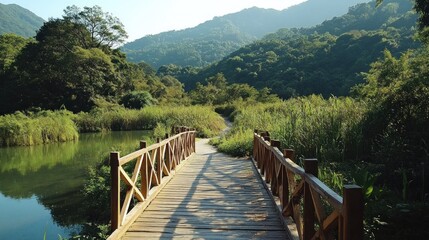 Obraz premium Serene Wooden Bridge Over Tranquil Lake in Lush Green Mountains