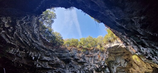 Melissani lake cave with iconic hole in rock