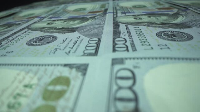 Close up view of brand new one hundred US dollars banknotes. 100 USD money background.