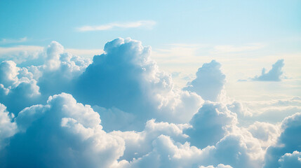A serene sky filled with fluffy white clouds against a soft blue backdrop, creating a peaceful and uplifting atmosphere.