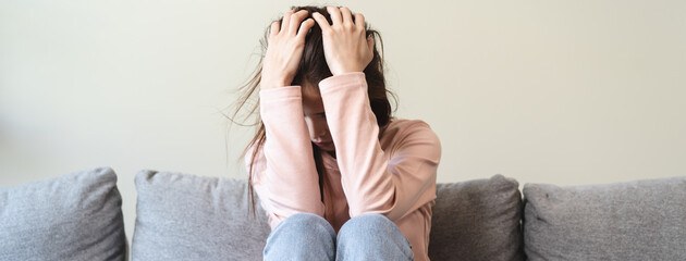 Depression in teenage concept, Young women covering her face feeling anxious and unhappy lock...
