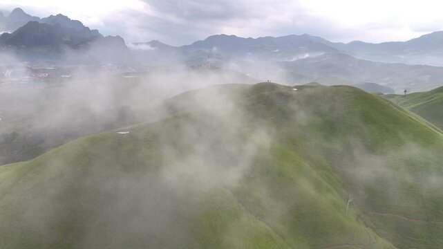 green mountain landscape with fog, Phou Hua Lon, Xaysomboun, Laos