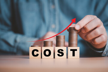 Businessman putting coins with up arrow for cost increasing in factory and business cost concept.