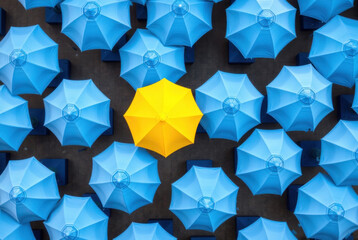 Unique umbrella stands out. Distinctiveness concept. Individuality, nonconformity, be different.