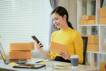 Portrait of Starting small businesses SME owners female entrepreneurs working on receipt box and...