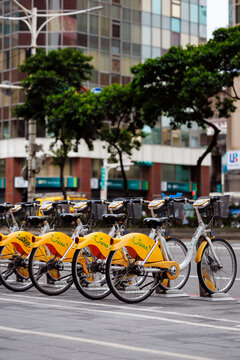 Public Bike Sharing Station with Yellow Ubikes in Urban Setting in Taipei, Taiwan