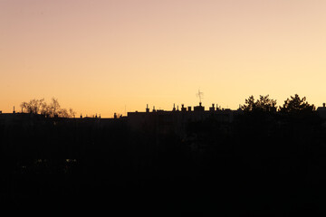  View of city buildings and chimneys.