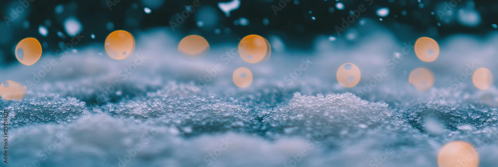 Poster Mesmerizing blurred snow texture falling softly in bright bokeh circles