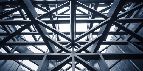 Intricate Steel Framework of a Modern Building with a Clear Sky View from Below, Showcasing the Art of Construction and Engineering Design