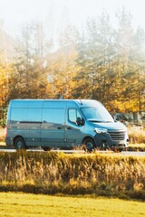 Vehicle driving open grassy landscape