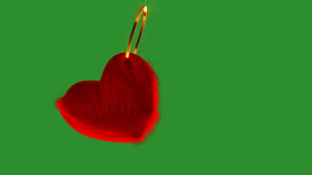 heart keychain animation on green background 