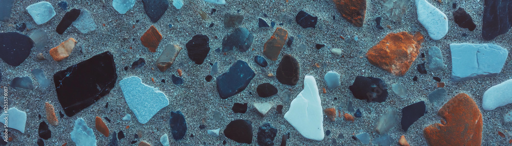 Poster Exposed aggregate cement showing various pebbles and textures on a bright background