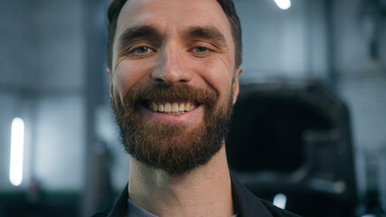 Caucasian man happy joyful guy industrial worker in uniform male mechanic engineer repairman technician electrician car service manager looking at camera cheerful smile satisfied automobile diagnostic