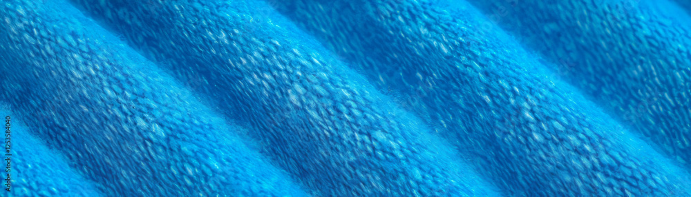 Poster Macro texture of denim with diagonal weave against a bright background for creative use