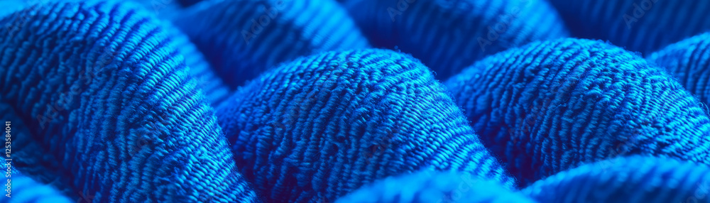 Poster macro texture of denim showcasing intricate diagonal weave and vibrant blue hues