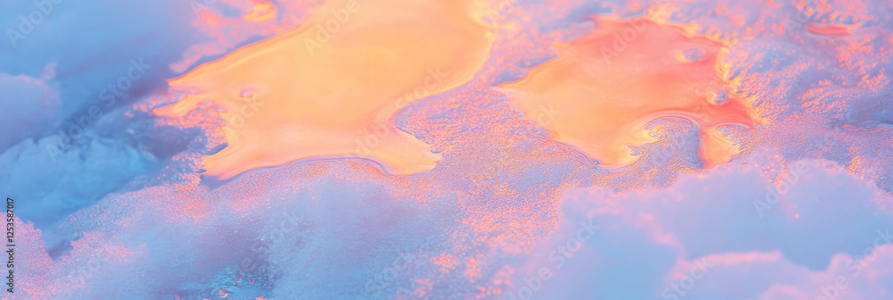 Poster melting snow reveals colorful patterns on textured ground in a bright setting