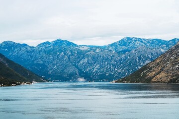 Lush mountain landscape with cloudy blue sky