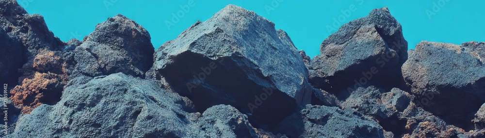 Poster detailed view of volcanic rock surface showcasing porous texture and sharp edges
