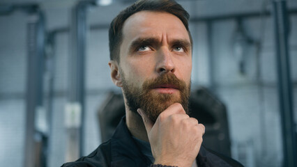 Pensive thoughtful guy Caucasian puzzled man thoughts think male auto mechanic engineer expert...