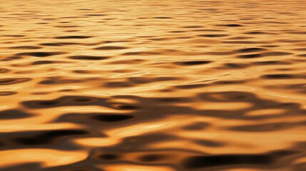Abstract golden water surface with wavy patterns creating a mesmerizing visual texture