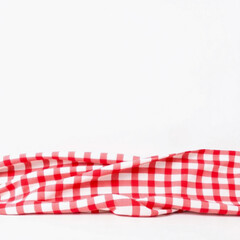 Obraz premium Classic red and white checked tablecloth isolated on white background
