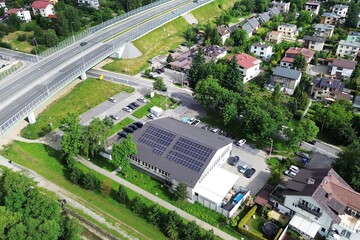 Solar panels on grocery store roof in residential area
