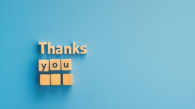 "Thank You" message made of blocks on blue background