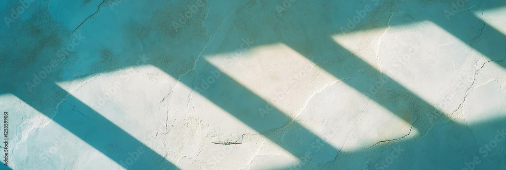 Poster venetian plaster surface with rough texture and long casting shadows in bright light