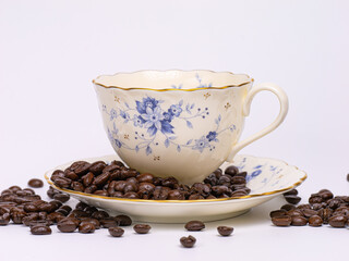 Coffee cup with coffee bean on a white backgrond