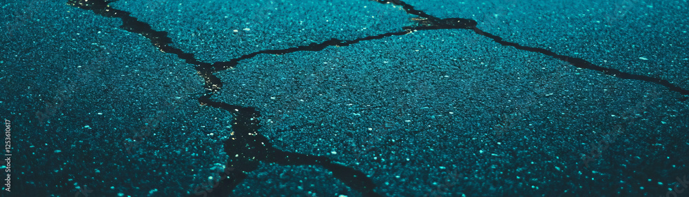 Poster close-up view of textured asphalt showcasing cracks and halftone detail for urban exploration